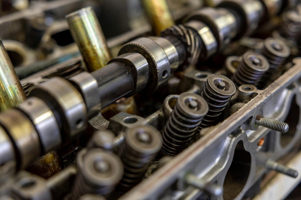 Detailed view of an engine camshaft and valve springs, showcasing mechanical precision.